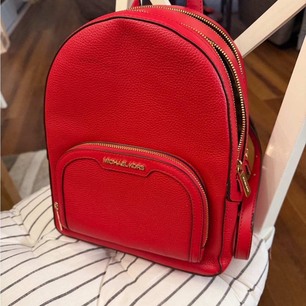 Michael Kors Jaycee Medium Backpack in a bright red pebbled leather
